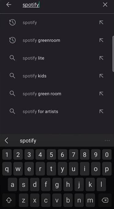 Type and search Spotify in the search bar